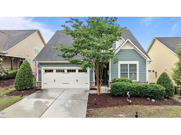 Charming home featuring a two-car garage, manicured landscaping, and lovely curb appeal at 1012 Autumn Meadow Ln, Wake Forest, NC 27587