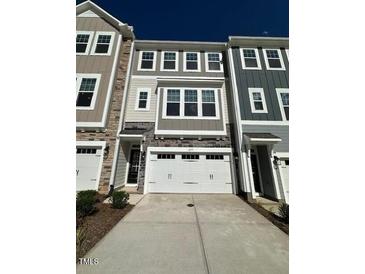 Charming townhouse with a two-car garage and neutral colored exterior at 2299 Bay Minette Sta # 537, Apex, NC 27502