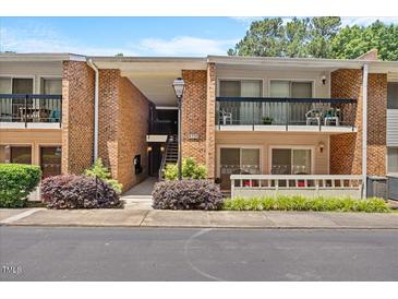 Charming condo with brick facade and cozy balcony; ideal for relaxing outdoors at 4709 Edwards Mill Rd # H, Raleigh, NC 27612