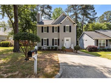 Charming two-story home with well-maintained landscaping and a classic design at 203 Kronos Lane, Cary, NC 27513