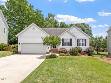 Charming single-story home with manicured lawn and inviting curb appeal at 1662 Beechaven Rd, Fuquay Varina, NC 27526
