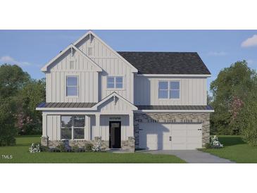 New two-story home with white siding, stone accents, a dark roof, and an attached two-car garage at 2325 Horton Park Dr, Apex, NC 27539