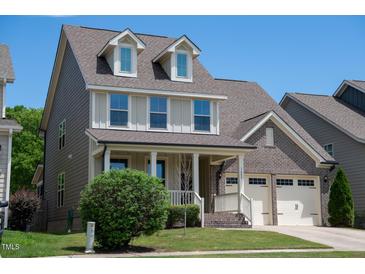 Charming two-story home with a welcoming front porch and attached two-car garage at 1600 Drift Falls Ln, Wendell, NC 27591