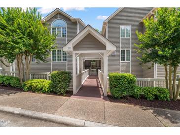 Inviting condos with a walkway entrance and mature trees in a well-kept community at 313 Glen Echo Ln # J, Cary, NC 27518