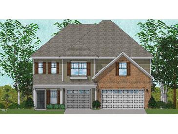 Charming two-story home featuring a brick facade, symmetrical windows and shutter accents, with a gray roof at 50 Guardian St, Youngsville, NC 27596