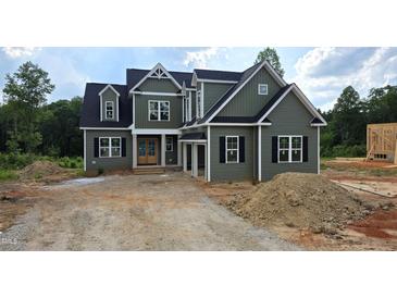New construction home with a green exterior, black shutters and a lawn that will be installed at 55 Livingston Ln, Spring Hope, NC 27882