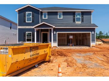 New two-story home under construction, showing siding, garage, and construction site at 736 Deschutes Dr, Garner, NC 27529