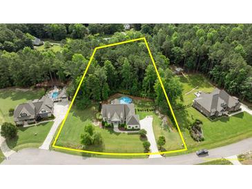 Spacious home on wooded lot with pool and outdoor living space at 1412 Wakefield Farm Rd, Zebulon, NC 27597