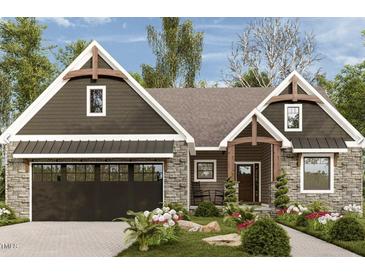 Beautiful craftsman-style home featuring a stone facade, dark siding, decorative timbers, and a black garage door at Lot 16H Good Shepherd Trl, Spring Hope, NC 27882