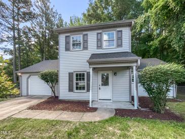 Charming two-story home with light siding, landscaped yard, and an attached garage, great curb appeal at 2705 Ramblegate Ln, Durham, NC 27705