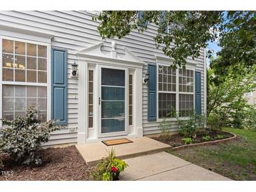Charming front door entrance featuring decorative trim and sidelights at 402 Halls Mill Dr, Cary, NC 27519
