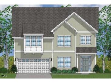 Charming two-story home featuring a light color scheme, symmetrical windows, and attached two-car garage at 61 Black Walnut Dr # 188, Garner, NC 27529