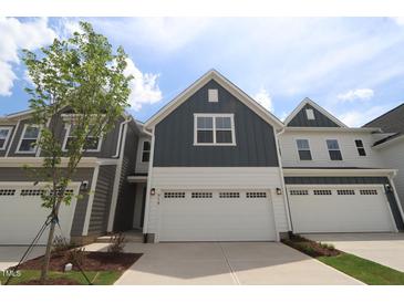 Charming home with a large garage and a well-manicured lawn and beautiful curb appeal at 914 Montague Ave, Durham, NC 27703