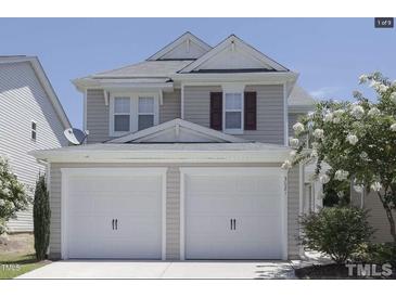 Charming two-story home featuring a two-car garage and well-maintained landscaping at 3021 Remington Oaks Cir, Cary, NC 27519