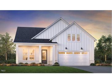 Charming new construction home featuring vertical siding, two-car garage, professional landscaping, and inviting front porch at 628 Gainer Dr # 18, Raleigh, NC 27610