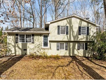 Charming two-story home with black shutters and well-maintained front yard landscaping at 1195 Champion Dr, Cary, NC 27511