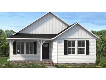 Charming one-story home featuring a classic black front door, bright white siding and black shutters at 4454 Poppy Mallow Ln, Oxford, NC 27565