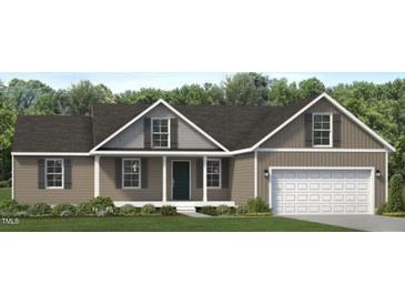 Charming one-story home with a classic architectural design, a two-car garage, and a well-manicured lawn at 4461 Poppy Mallow Ln, Oxford, NC 27565