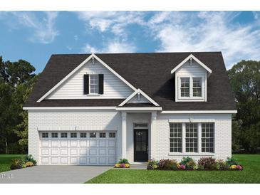 Charming, light brick two-story home featuring a front-entry two car garage and classic dormer windows at 356 Beacon Hill Rd # 103, Lillington, NC 27546