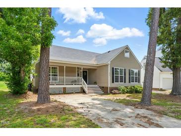 Charming home featuring a covered front porch and well-maintained landscaping at 4905 Knightsbridge Way, Raleigh, NC 27604