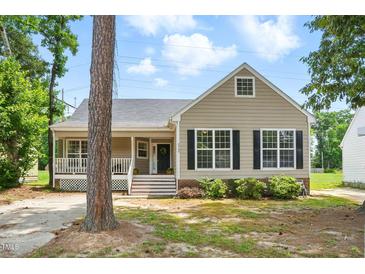 Charming single Gathering home with a cozy front porch and well-maintained landscaping at 4905 Knightsbridge Way, Raleigh, NC 27604