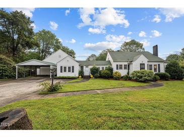 Charming one-story home with a well-manicured lawn, complemented by a convenient carport at 1146 Rogers Rd, Graham, NC 27253