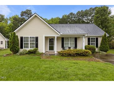 Charming single-story home with light siding, black shutters, and a well-maintained lawn at 139 Carriage Hill Dr, Stem, NC 27581