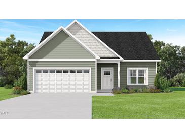 Charming single-Gathering home with a two-car garage and manicured front lawn at 2816 Ricolden Trl, Elon, NC 27244