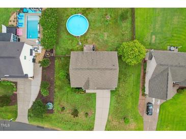 Aerial view of a single-Gathering home with a pool and well-maintained yard at 50 Consella Way, Franklinton, NC 27525