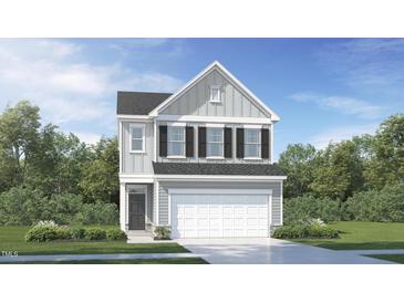 Two-story home with neutral siding, black shutters, and a two-car garage in a Gathering-friendly neighborhood at 108 Fishing Pier Way, Lillington, NC 27546