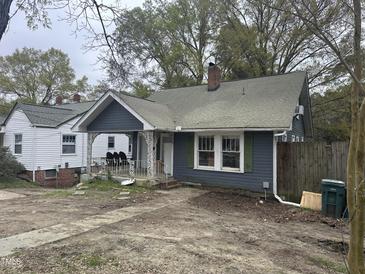 Charming single-story home with a covered porch, showing curb appeal and classic architectural details at 0 Chapel Hill Rd, Durham, NC 27707