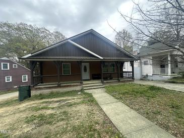 Charming home with a welcoming front porch and a well-maintained walkway leading to the entrance at 2509 Chapel Hill Rd, Durham, NC 27707