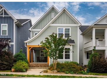 Charming two-story home featuring a welcoming front porch and beautiful landscaping at 290 Quarter Gate Trce, Chapel Hill, NC 27516