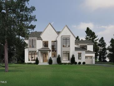 Stunning white brick home featuring grand windows, gray accents, and a well-manicured lawn at 413 Shinleaf Pond Trl, Raleigh, NC 27614