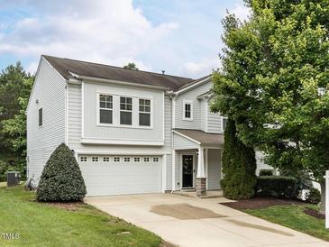Charming two-story home with a well-maintained front yard, attached garage, and a welcoming entrance at 4234 Offshore Dr, Raleigh, NC 27610