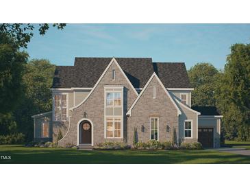 Charming two-story home featuring stone accents, arched entryway, and lush green lawn at 441 Lila Dr, Pittsboro, NC 27312