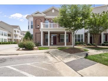 Beautiful brick condo with a charming balcony, trimmed shrubbery and a well-maintained lawn at 10529 Sablewood Dr # 111, Raleigh, NC 27617