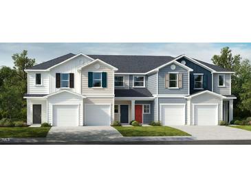 Charming townhome exteriors showcase varied colors and attached garages for a modern look at 10564 Brookside Reserve St, Raleigh, NC 27614