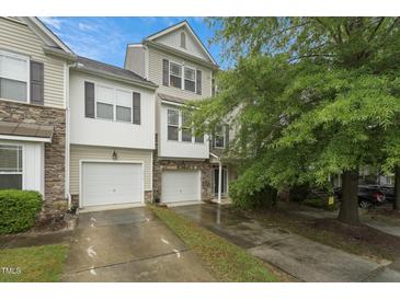 Charming townhome with two-car garage and well-maintained landscaping at 9808 Rainsong Dr, Wake Forest, NC 27587