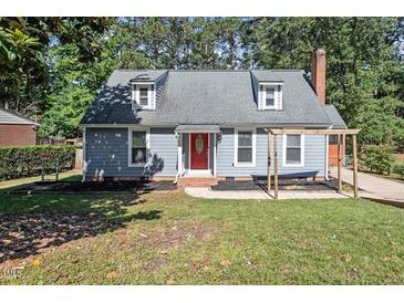 Charming home with a red front door and a well-maintained lawn and landscaping at 111 Mcdole Cir, Cary, NC 27511