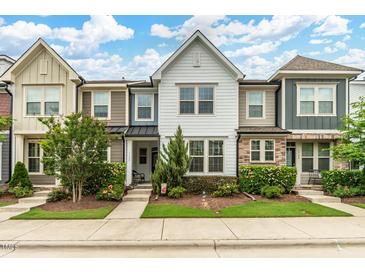 Charming townhome with well-manicured lawn and landscaping, perfect for curb appeal at 1728 Shady Oaks Dr, Wendell, NC 27591