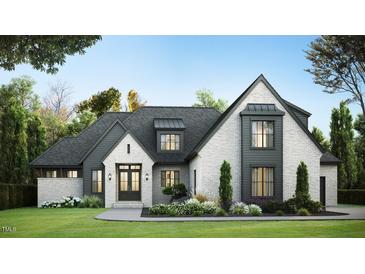 Striking white brick home with black trim, manicured lawn, and professional landscaping creates an inviting curb appeal at 1808 Stream Manor Ct, Wake Forest, NC 27587