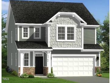 Charming two-story home with a two-car garage and stone accents at 243 Steel Springs Ln # 25, Angier, NC 27501