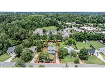 This aerial view showcases the property's location, yard, and surrounding community amenities at 601 Country Ln, Holly Springs, NC 27540