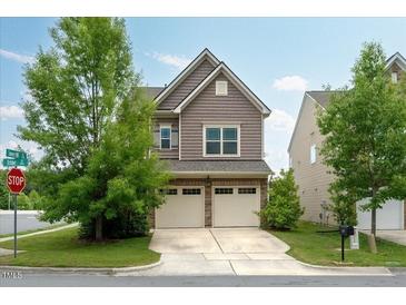 Charming two-story home with a two-car garage and well-maintained lawn at 2001 October Dr, Durham, NC 27703