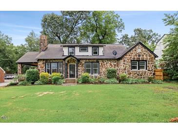 Charming stone home with a well-maintained lawn, mature trees, and inviting curb appeal at 205 Forest Hill Ave, Rocky Mount, NC 27804