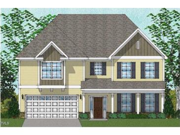Charming two-story home featuring a welcoming porch and a two-car garage, nestled among lush trees at 74 Black Walnut Dr # 199, Garner, NC 27529