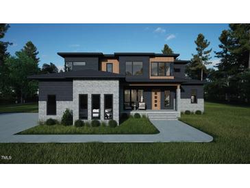 Stunning modern home with a sleek design, mixed materials, and manicured landscaping for curb appeal at 10 Gambel Dr, Youngsville, NC 27596