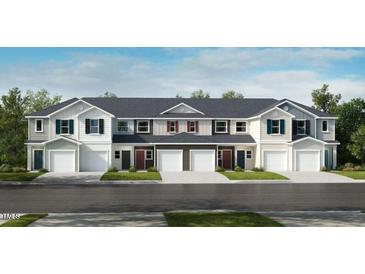 New townhomes feature white and gray facades, single-car garages, and professionally landscaped lawns at 2003 Rabbitbrush St, Durham, NC 27704