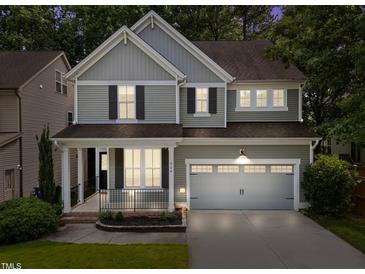 Charming two-story home with a two-car garage and inviting front porch at 904 Pirouette Ct, Raleigh, NC 27606